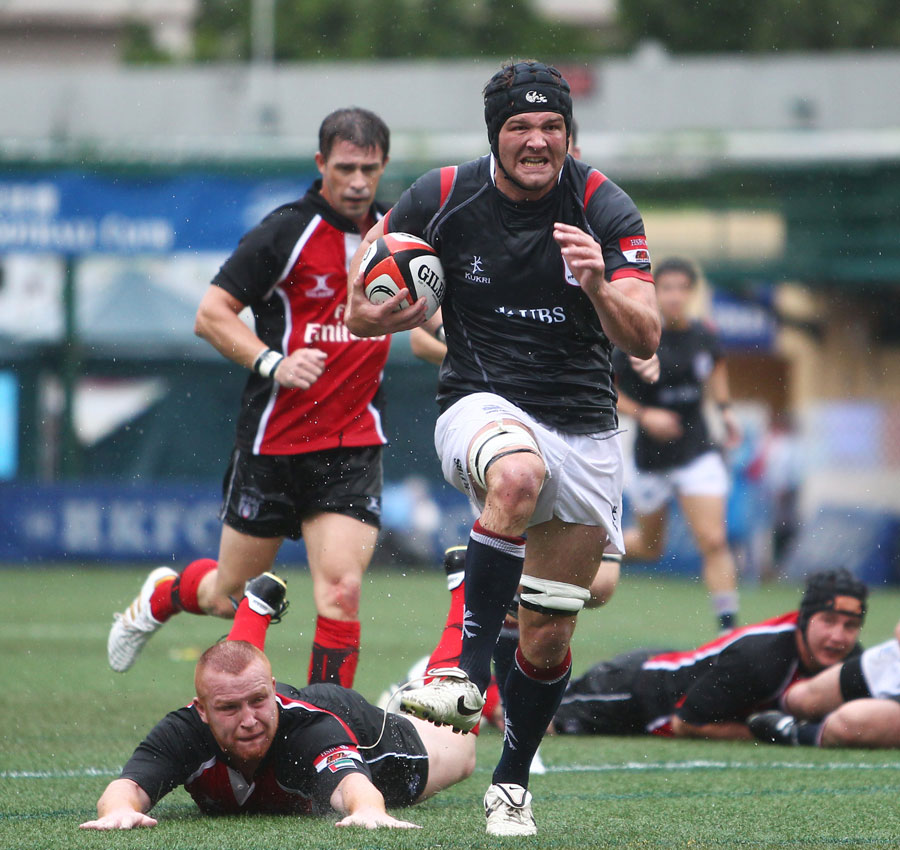 Hong Kong's Nick Hewson races away to score against the United Arab Emirates