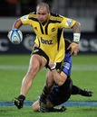 The Hurricanes' John Schwalger stretches the Western Force defence