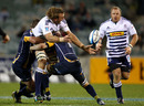 Stormers lock Andries Bekker manages to offload in the tackle