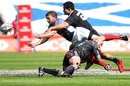 Russia's Sergey Sugrobov is tackled by New Zealand's DJ Forbes and Shane Christie 