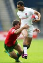 England's Dan Norton is tackled during the clash with Portugal