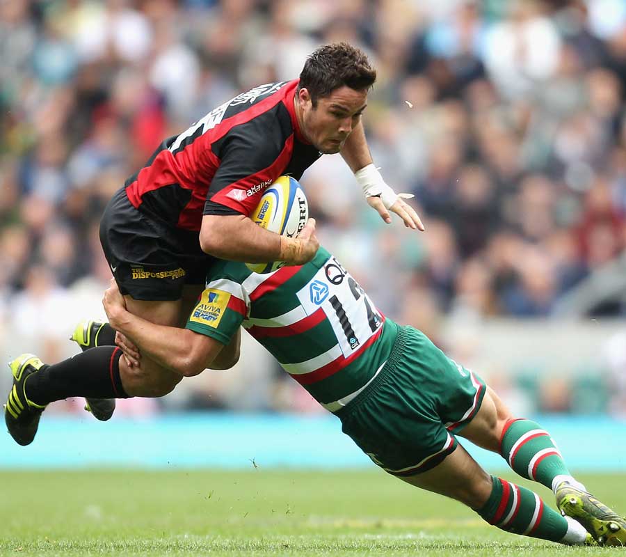 Saracens centre Brad Barritt is upended by Leicester's Anthony Allen