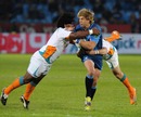 The Bulls' Wynard Olivier is hit by two Cheetahs tacklers