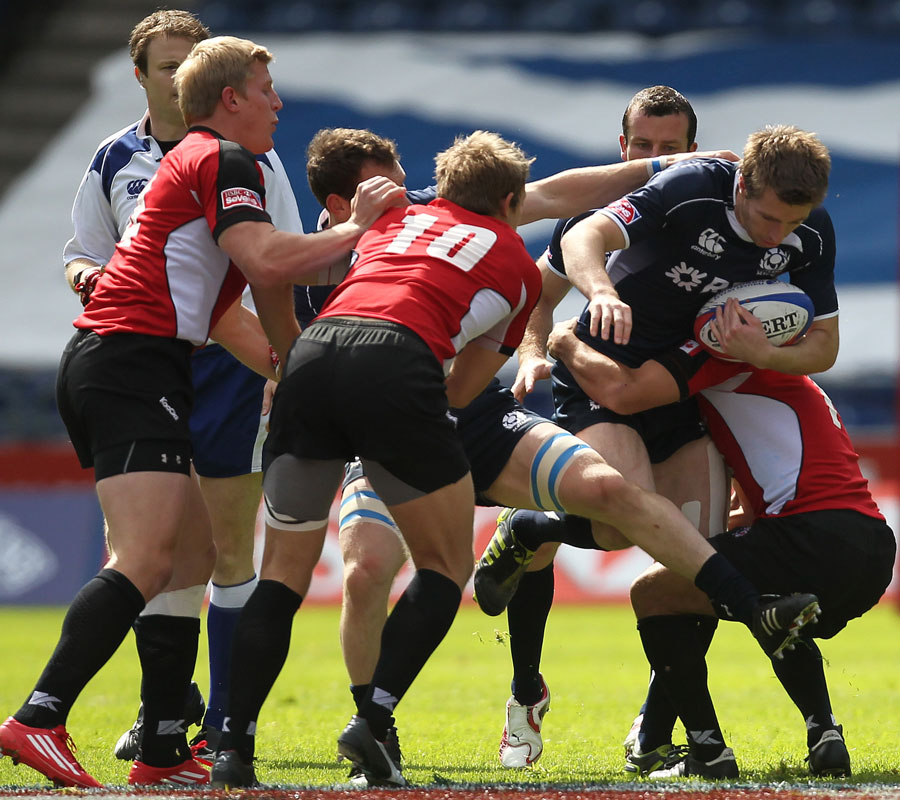 Scotland's Jim Thompson carries the ball into the Canada defence