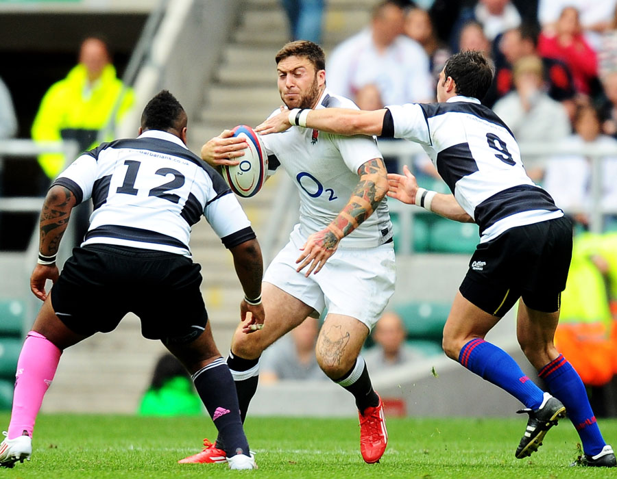 England's Matt Banahan carries the ball into the Barbarians defence