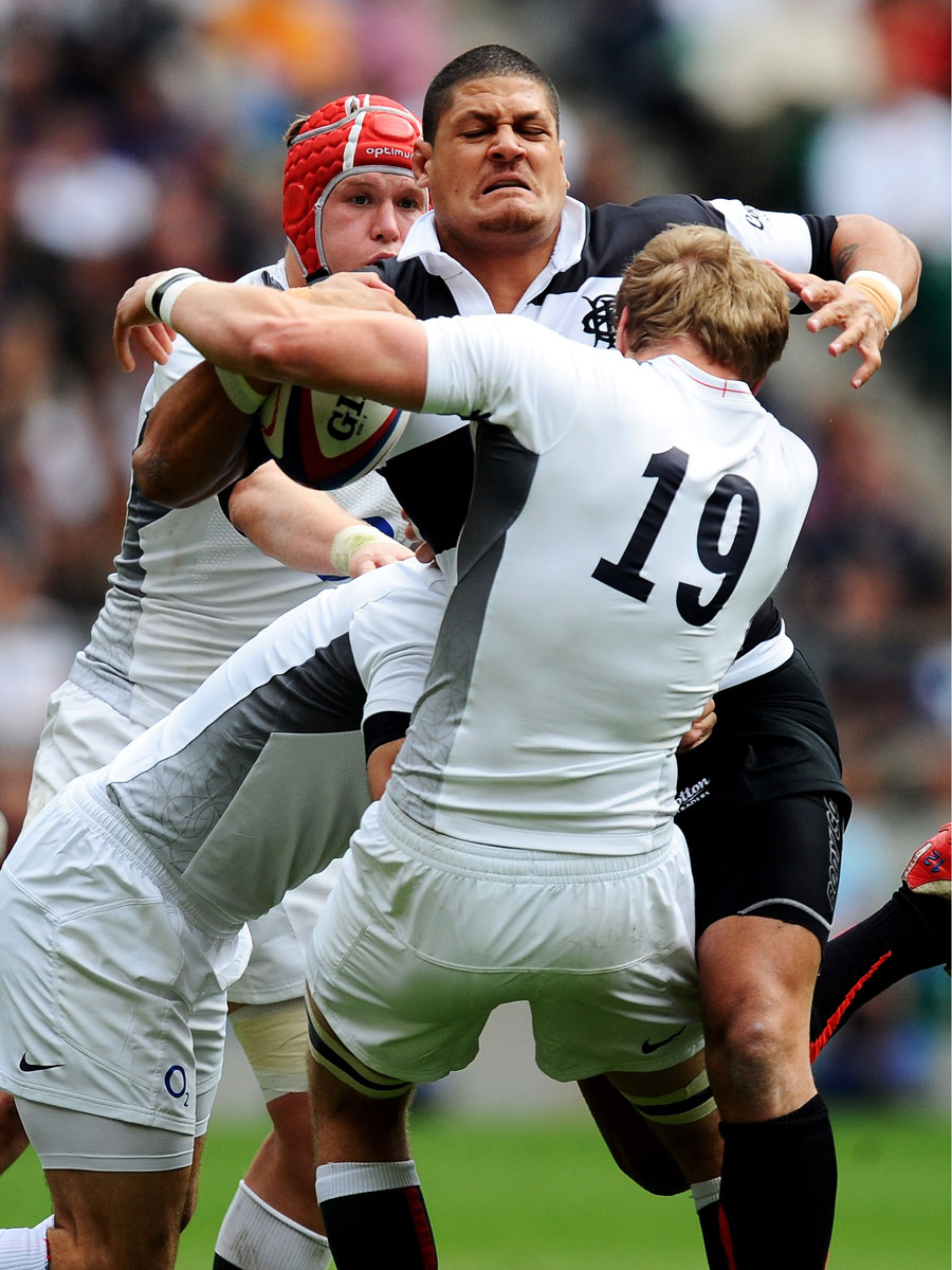 England's defence struggles to hold the Barbarians' Willie Mason