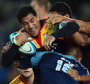 The Chiefs' Mils Muliaina is wrapped up by the Blues' defence