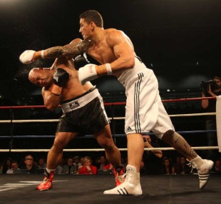 Sonny Bill Williams lands a punch on Alipate Liav'a, Trusts Stadium, Waitakere, New Zealand, June 4, 2011