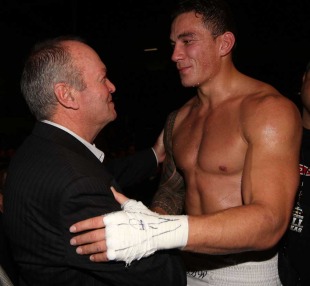 Sonny Bill Williams greets All Blacks coach Graham Henry after winning his fourth professional boxing bout, Trusts Stadium, Waitakere, New Zealand, June 4, 2011