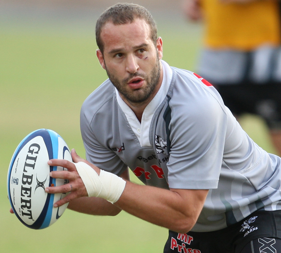 The Sharks' Frederic Michalak looks to shift the ball