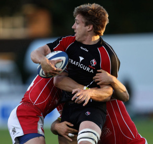 Canada's Chauncey O'Toole is tackled by Russian defenders, Esher RFC, June 8, 2011