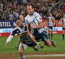 The Bulls' Francois Hougaard evades the Stormers' Bryan Habana on his way to the line