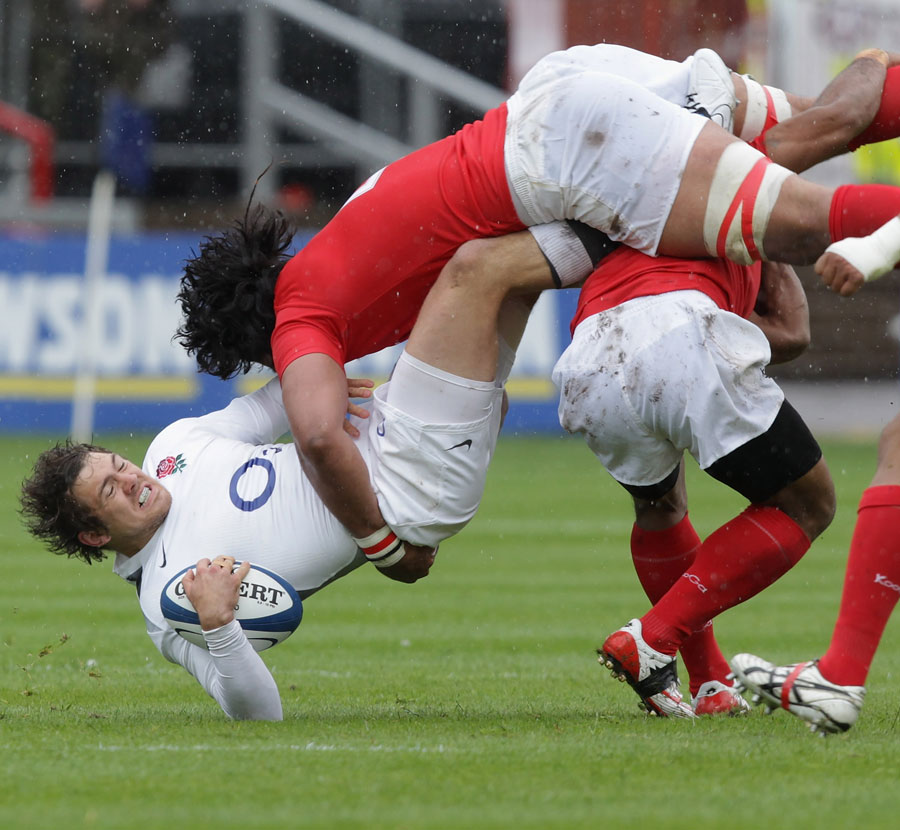 England Saxons fullback Alex Goode is levelled by Sione Timani