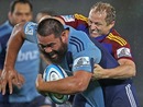 The Highlanders' Tony Brown attempts to tackle the Blues' Charlie Faumuina