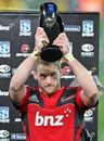 Crusaders captain Kieran Read lifts the New Zealand Conference Super Rugby trophy