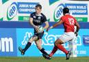 Scotland's Mark Bennett tries to step his way past Tonga