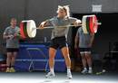 Dmitri Szarzewski lifts weights during an indoor session