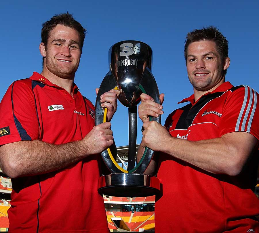 Reds captain James Horwill and Crusaders skipper Richie McCaw pose with the Super Rugby silverware