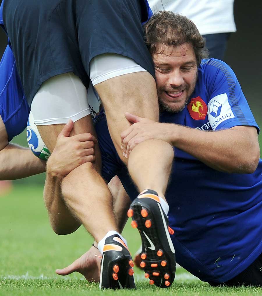 France's Cedric Heymans gets to grips with a teammate during training