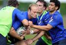 French flanker Julien Bonnaire vies with center Maxime Mermoz during training