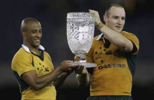 George Gregan and Stirling Mortlock  hold the Cook Cup after defeating England at the Telstra Dome on June 17, 2006