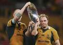 Stirling Mortlock and Phil Waugh lift the James Bevan Trophy