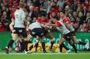 Digby Ioane of the Reds tries to break away