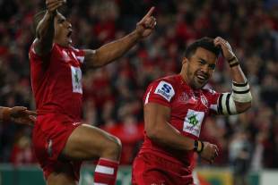 The Reds winger Digby Ioane celebrates his try