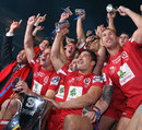 The Reds celebrate with the Super Rugby trophy