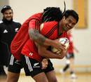 New Zealand's Ma'a Nonu gets to grips with team-mate Isaia Toeava