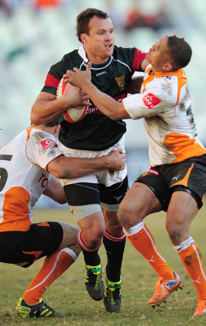 The Leopards' George Tossel attempts to break through the Cheetahs' defence