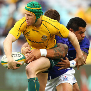 Australia's Matt Giteau offloads against Samoa, Australia v Samoa, ANZ Stadium, Sydney, Australia, July 17, 2011
