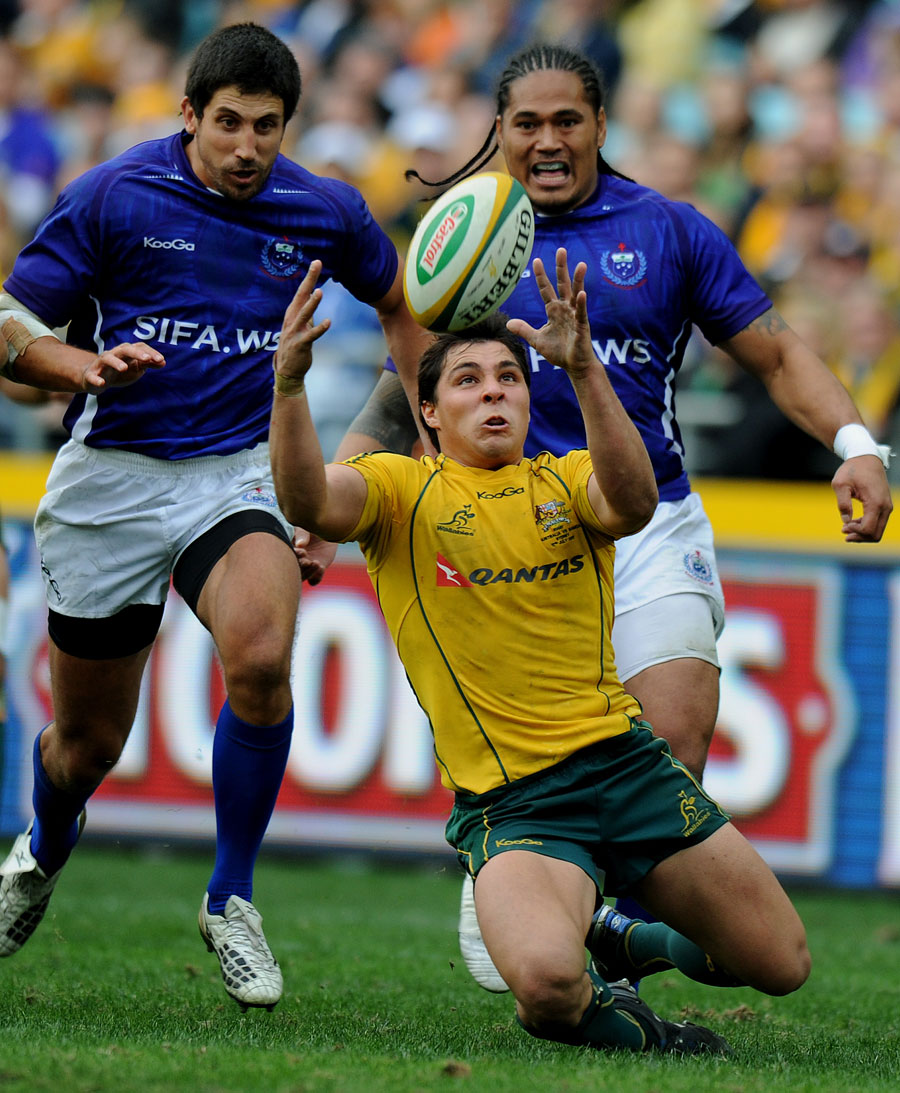 Wallabies scrum-half Nick Phipps attempts to gather a loose ball