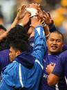 Samoa celebrate their victory over Australia