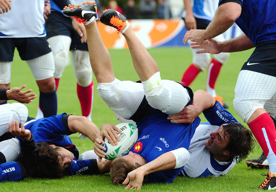 France wing Vincent Clerc is upended in training