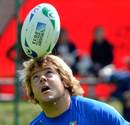 Italy's Andrea Lo Cicero keeps his eye on the ball during training