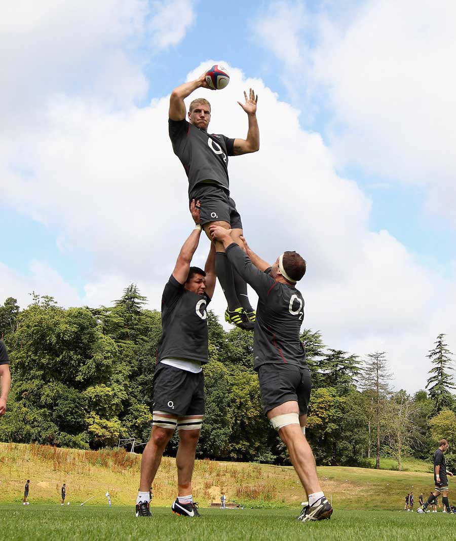 England's James Haskell is lifted during training