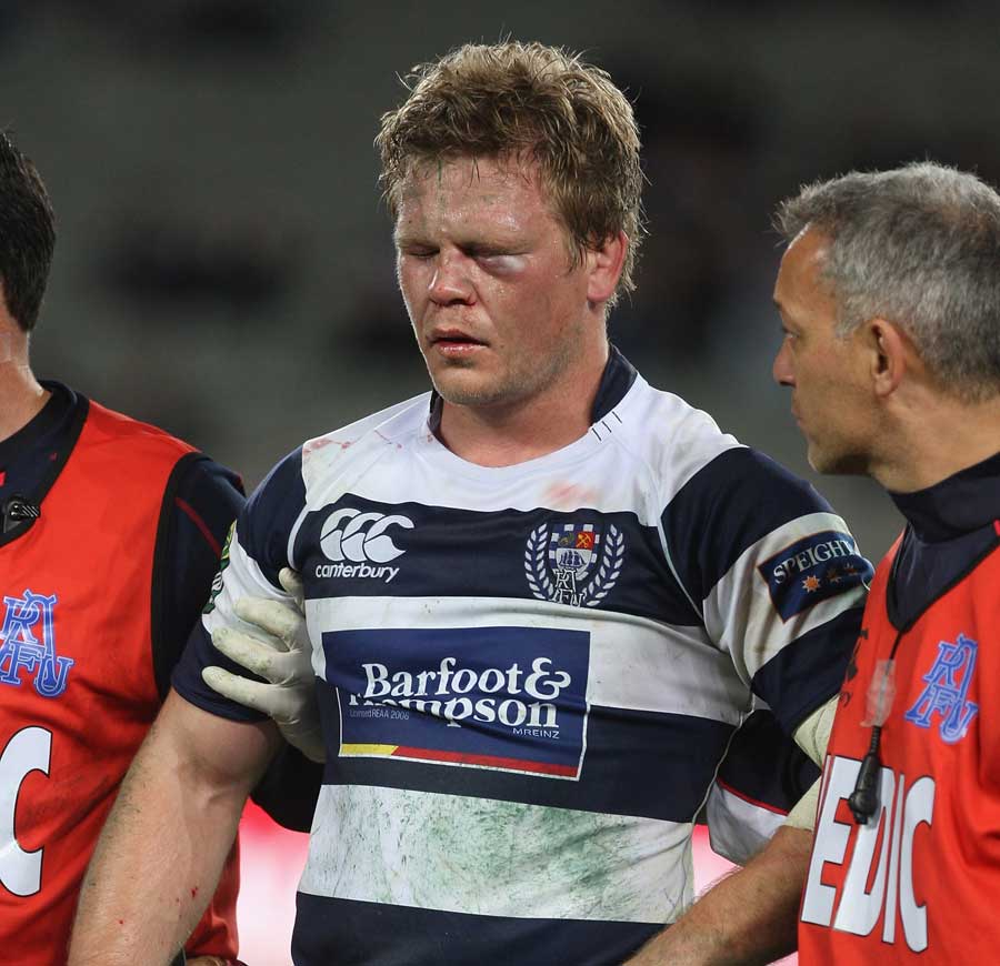 Auckland's Daniel Braid is helped from the field