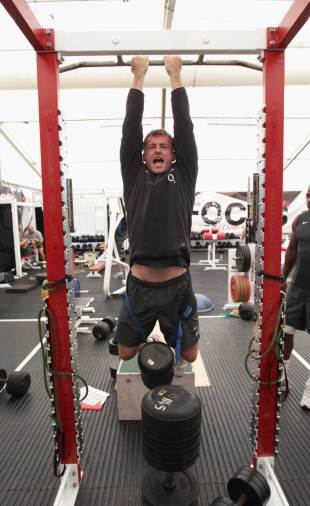 England's Mark Cueto attempts a weighted pull-up