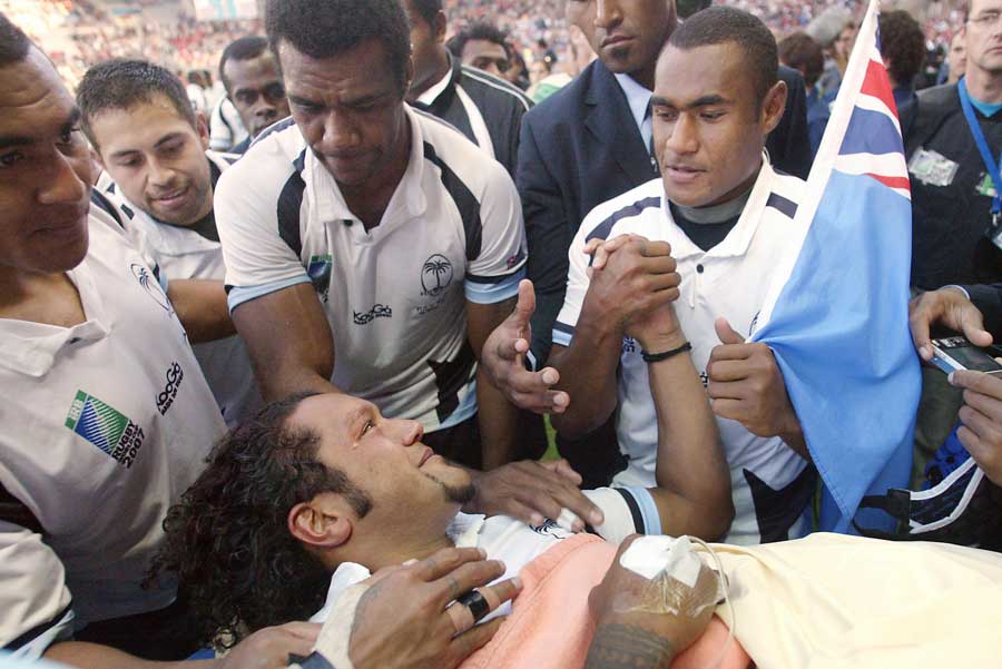 Injured Fijian fly-half Nicky Little is supported by his team-mates