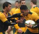Australia wing Digby Ioane hands off Nick Phipps