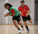 Ma'a Nonu scoops up the ball with Richie McCaw in support