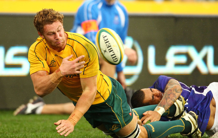 Australia's Scott Higginbotham off-loads in the tackle