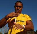 Australia's Sekope Kepu tapes up his hand before training