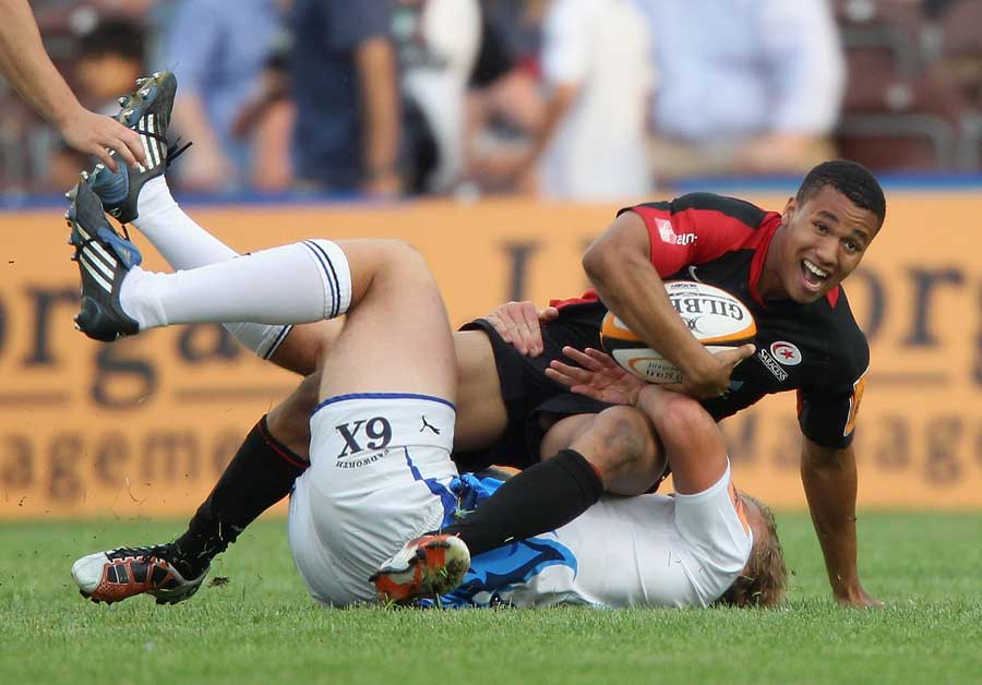 Saracens' Marcus Watson is held up by his opponent