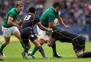 Ireland flanker Mike McCarthy takes on the Scotland defence