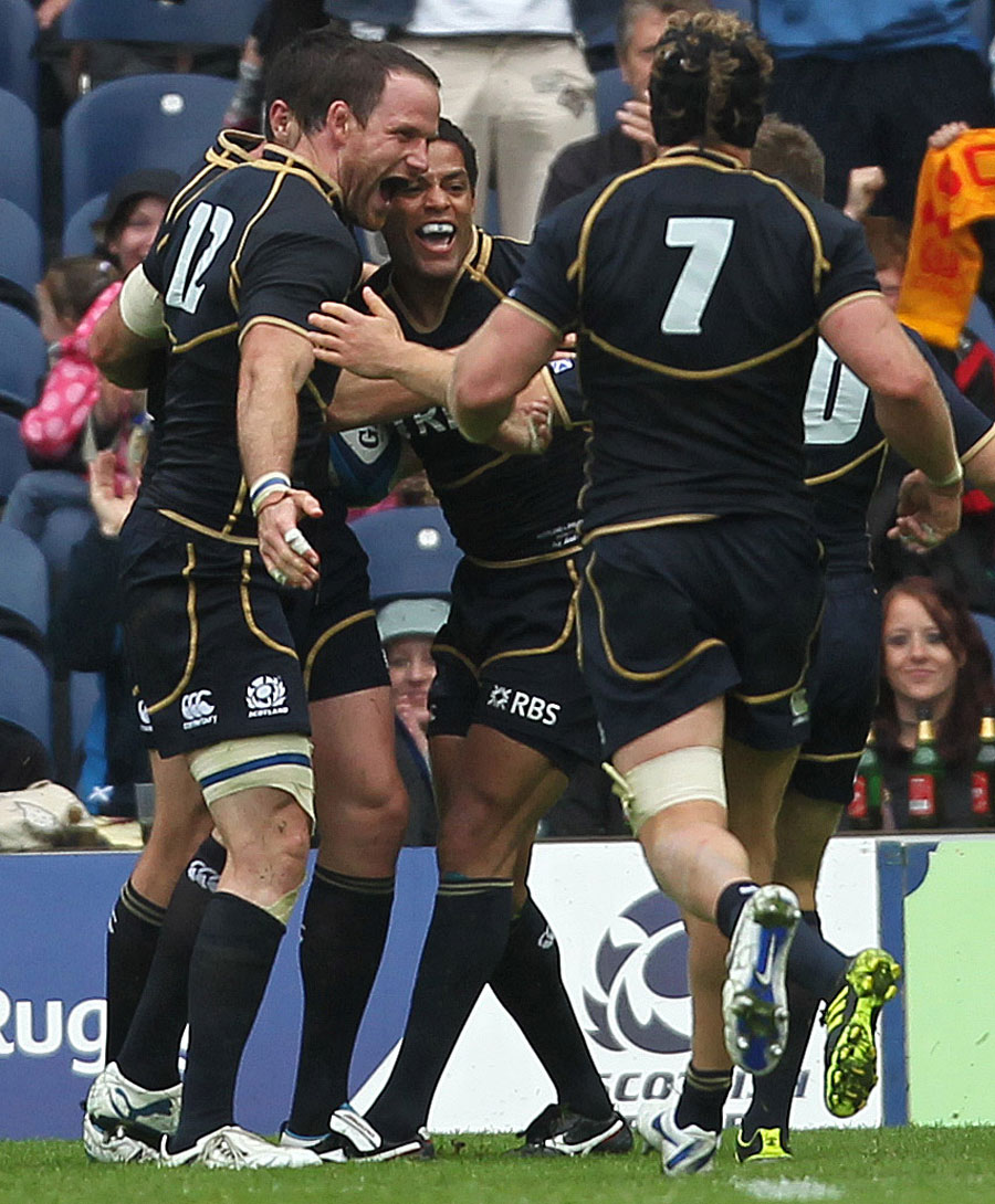Scotland centre Joe Ansbro is congratulated after his try
