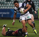 Auckland's George Moala bursts through a tackle against North Harbour