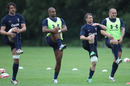 Wales' Jonathan Thomas (l), Aled Brew (2l), Shane Williams (2r) and Craig Mitchell have a stretch during training