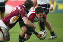 North Harbour's Ben Botica is cut-down by the Southland's defence